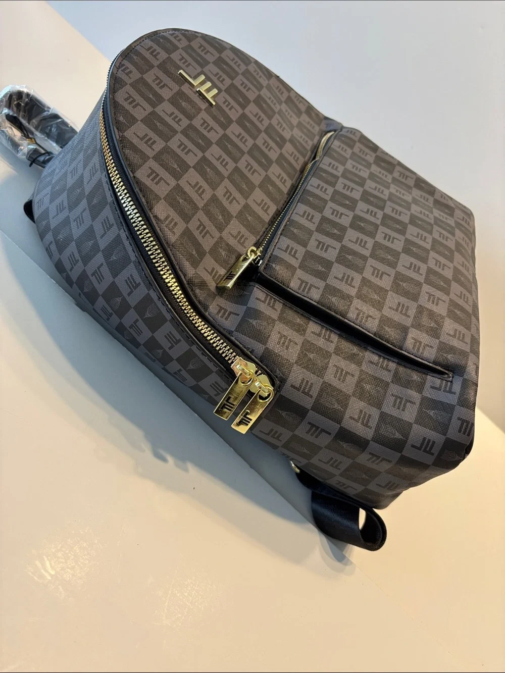 London Fog Women's Raven Tower Signature Print Backpack in Black